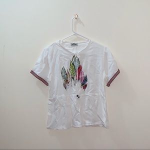 White graphic shirt.